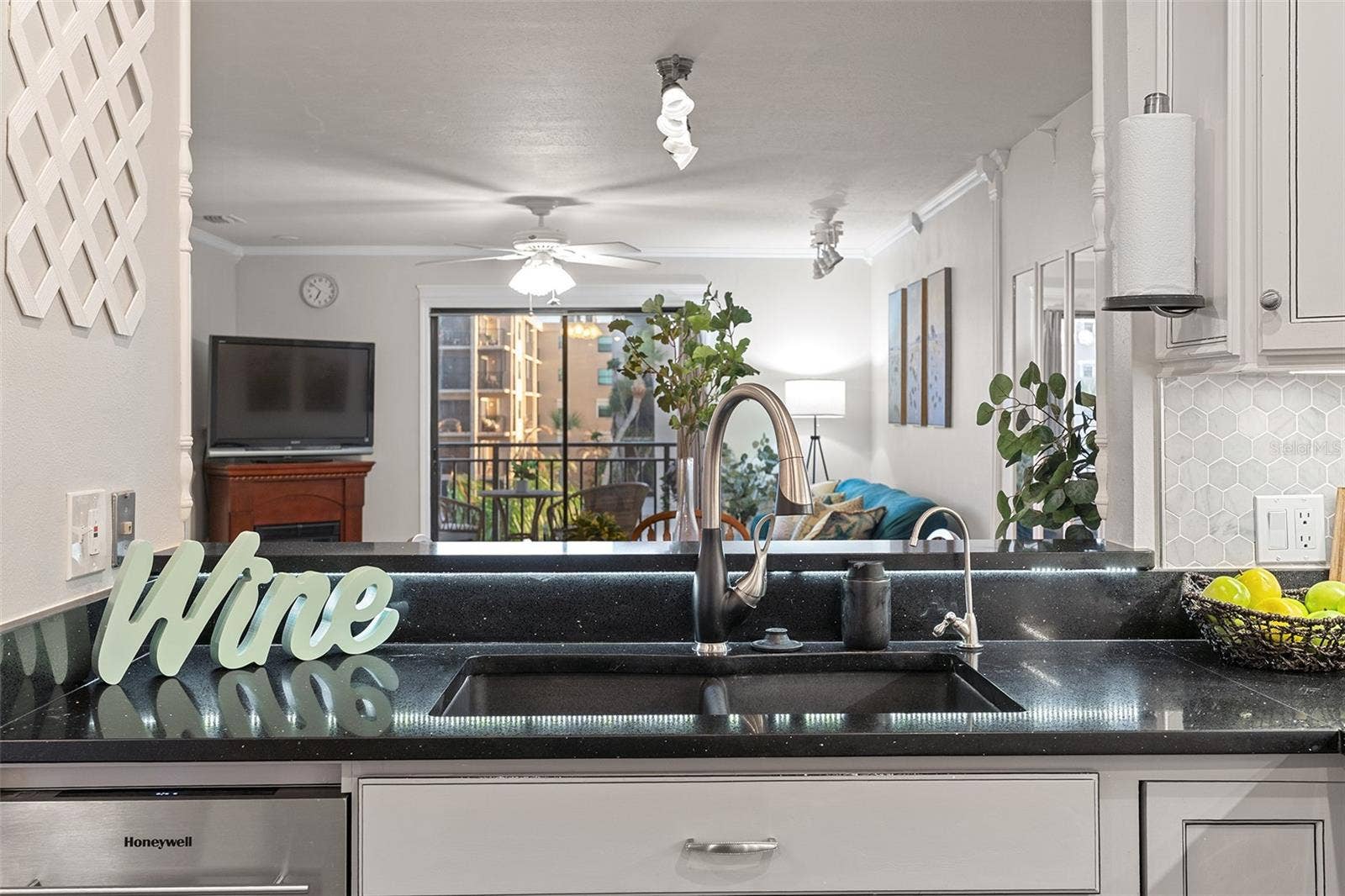 Kitchen sink overlooks living area
