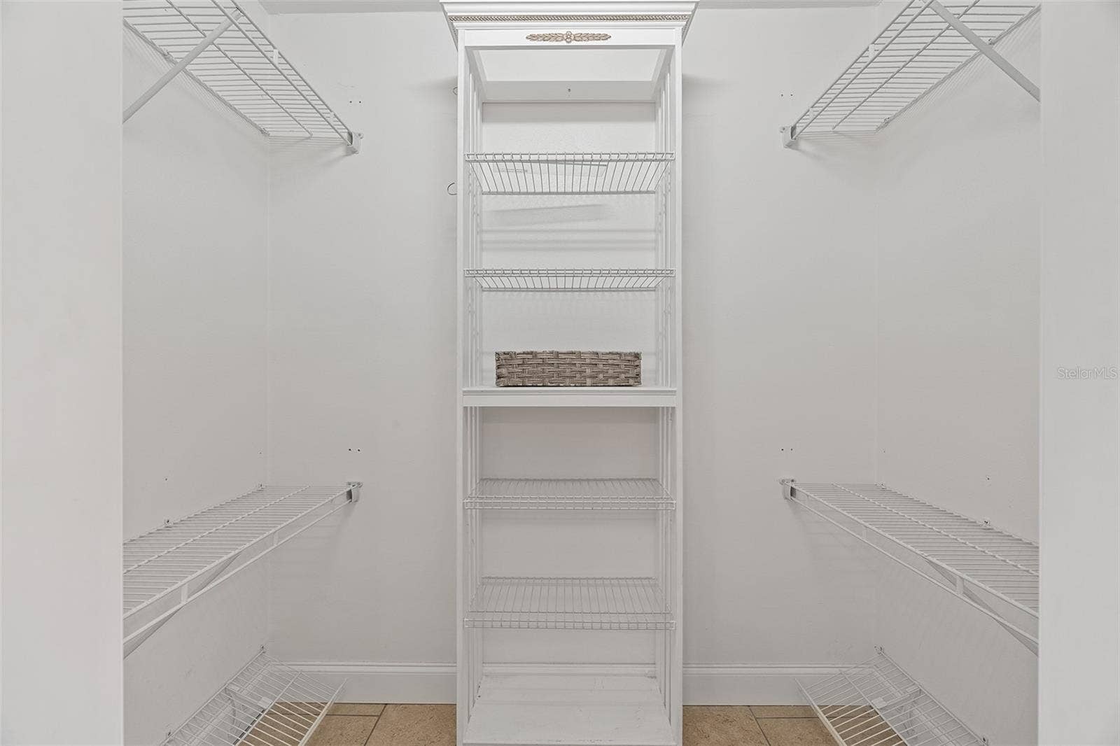 Primary bedroom walk in closet
