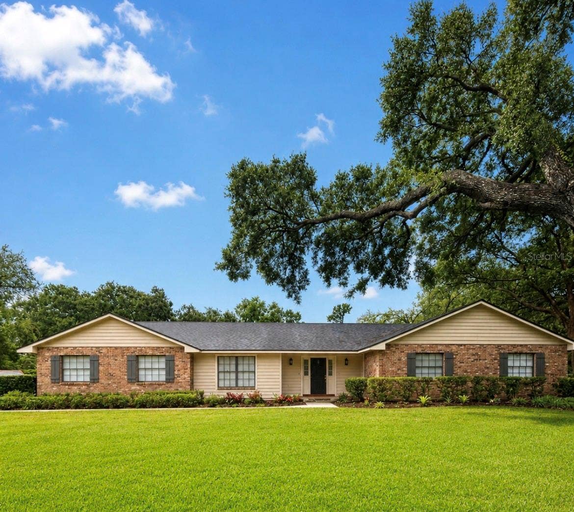 14140 COUNTRY ESTATE DRIVE, Winter Garden, FL 34787 Welcome home to timeless charm under the shade of a beautiful mature oak trees. This inviting brick home offers a peaceful setting, a spacious front lawn, and classic curb appeal that feels warm from the moment you arrive.
