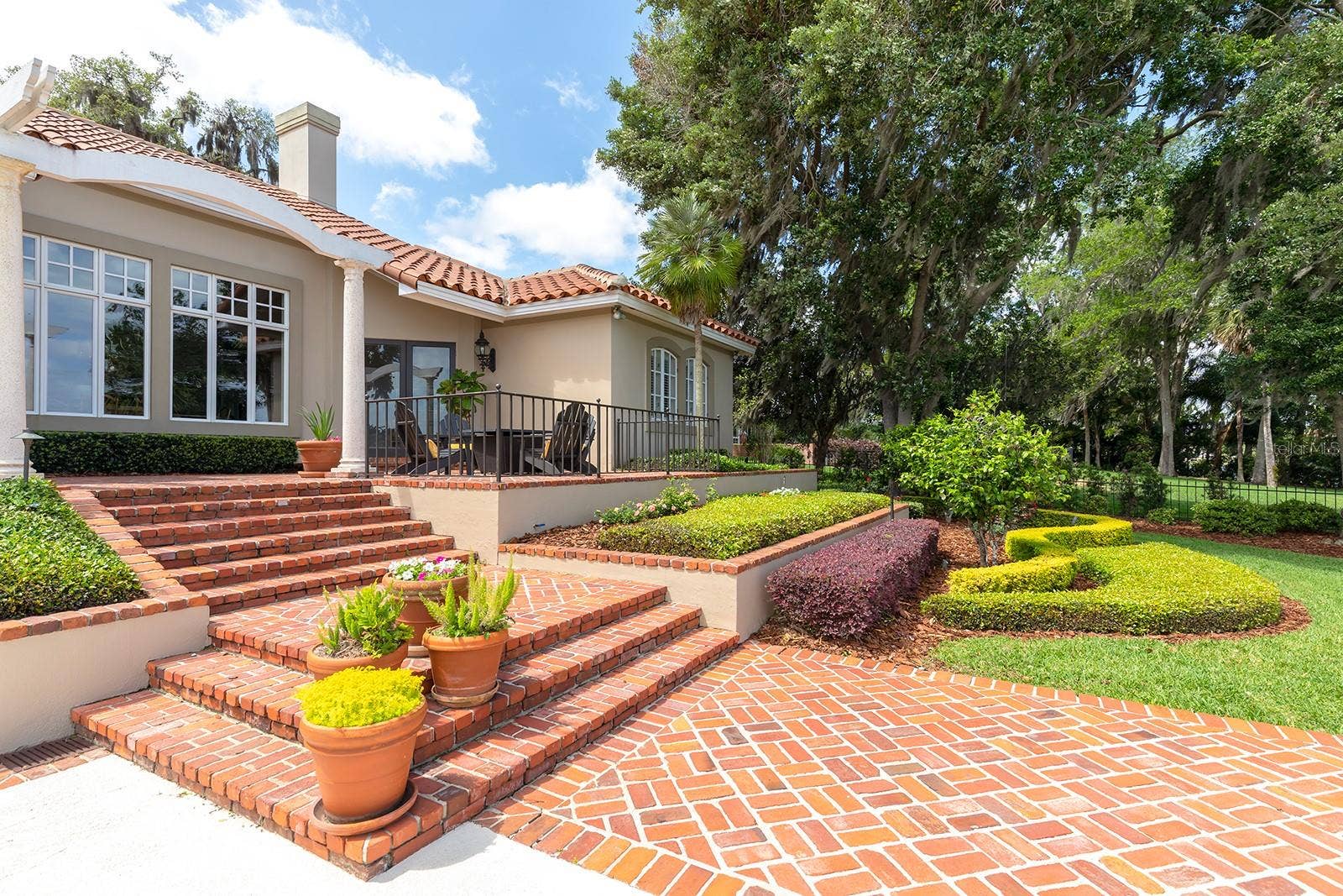 1351 N CLASSIC COURT, Longwood, FL 32779 Generous use of St. Louis brick, wood flooring, and wrought iron artistry.