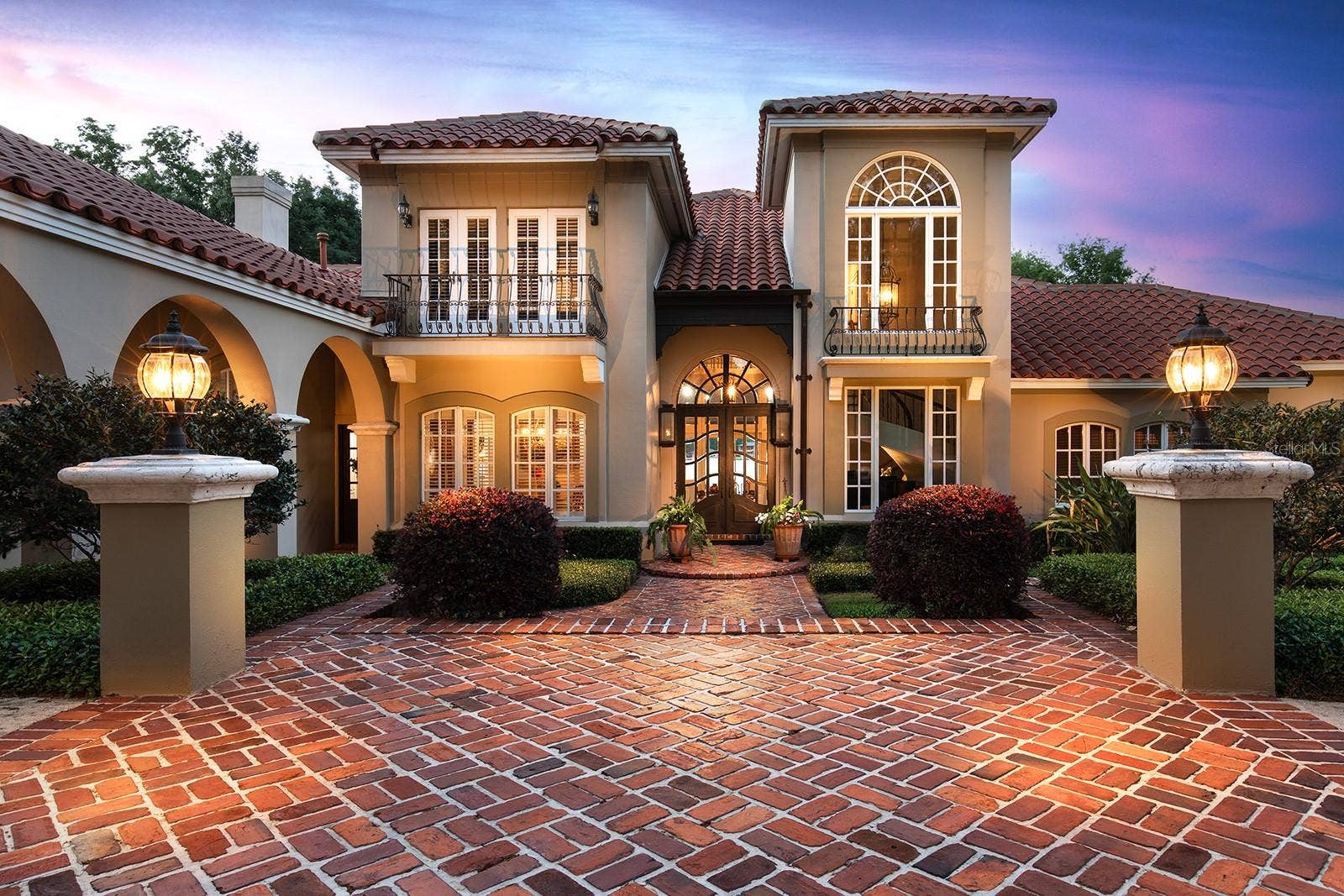 1351 N CLASSIC COURT, Longwood, FL 32779 When the sunsets the home is illuminated by warm and inviting lighting coming from the residence and landscaping. It is all designed to welcome you home day or night.