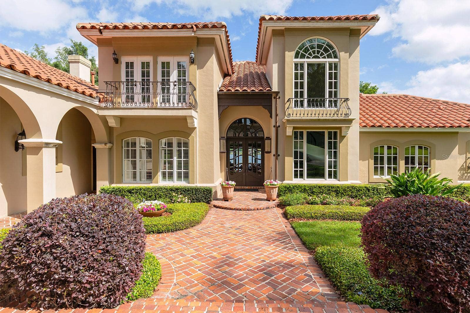 1351 N CLASSIC COURT, Longwood, FL 32779 Generous use of St. Louis Brick, and stately balconies make for a regal entry.
