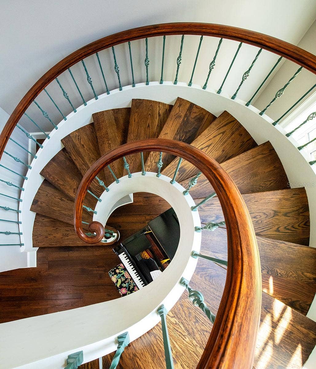 1351 N CLASSIC COURT, Longwood, FL 32779 Every sense is tickled in this architectural wonder. Views of spiral woodworking or custom wrought iron, custom volume windows and ceiling, crown molding and elaborate firecplaces and mantels, add the designer touch at every angle.