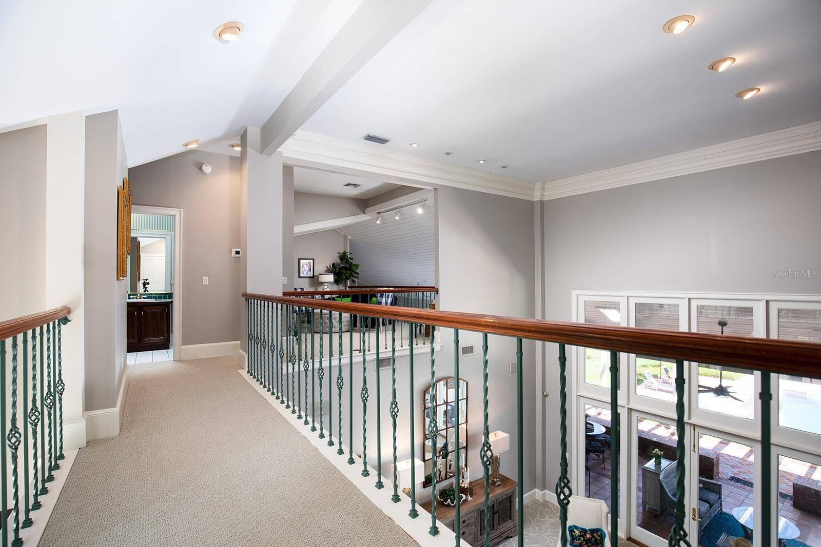1351 N CLASSIC COURT, Longwood, FL 32779 Walkway above the first floor that leads to the loft, additional bedroom and bathroom. Private get away space and yet you still feel like you are part of the main activities.