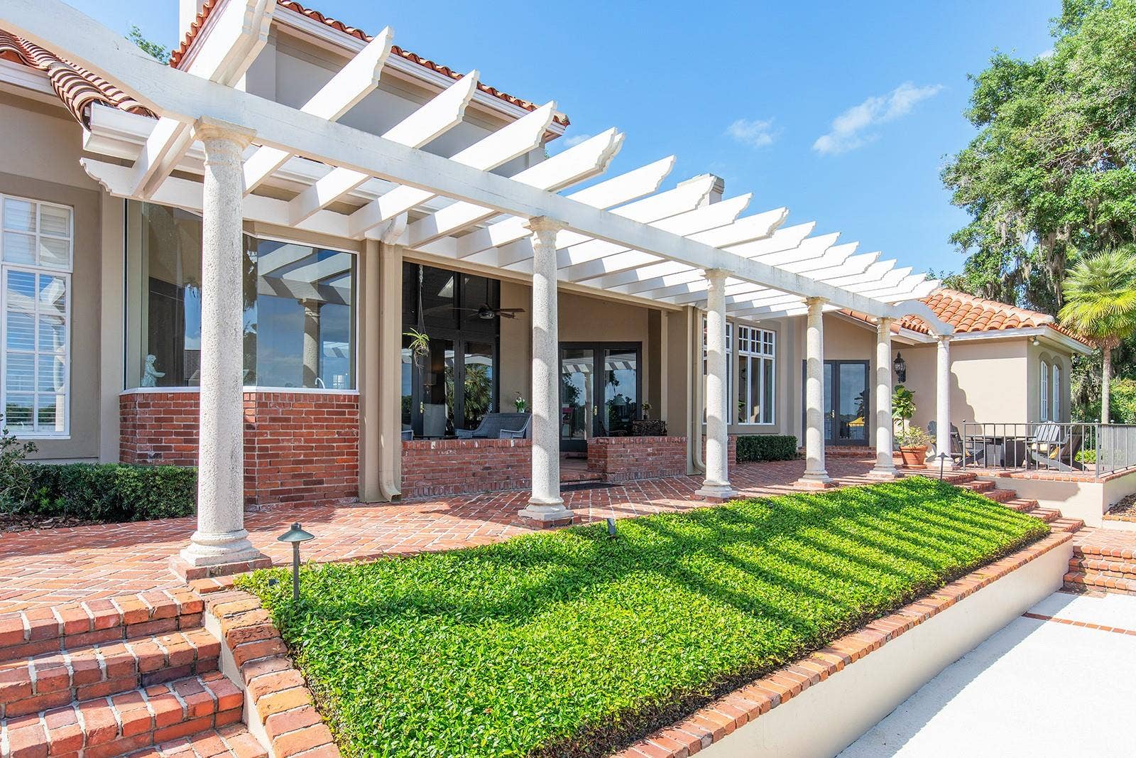 1351 N CLASSIC COURT, Longwood, FL 32779 Lush landscaping and detail with an abundance of St. Louis brick and impressive pergola