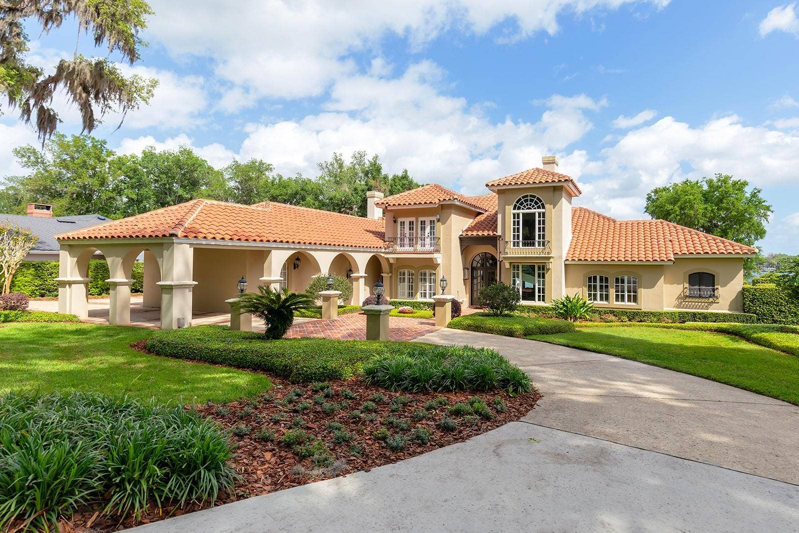1351 N CLASSIC COURT, Longwood, FL 32779 Biltmore GAS LANTERNS, SHUTTERS, BALCONIES & TOWERING tree canopies as you approach this MEDITERRANEAN-RIVIERA style estate.