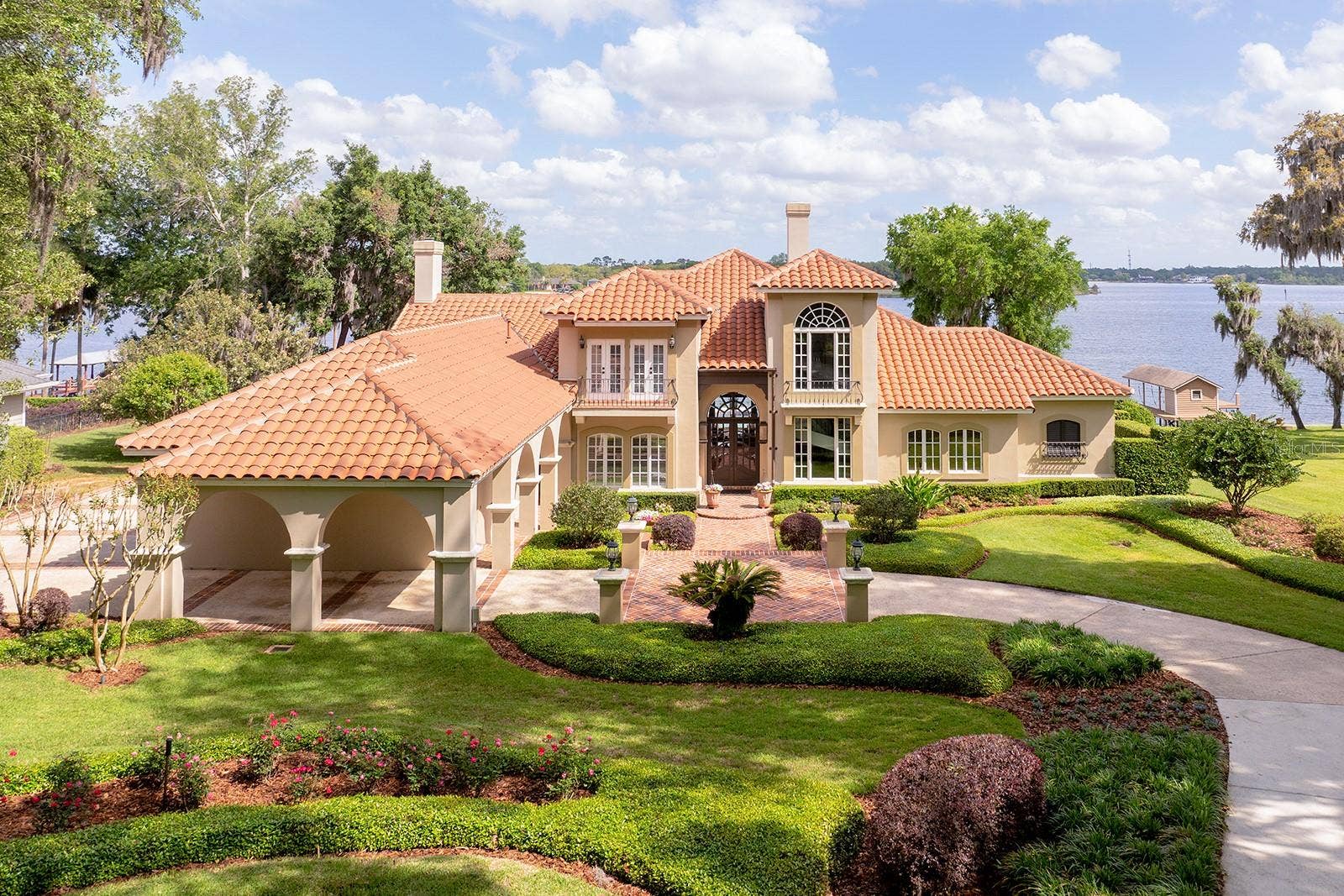 1351 N CLASSIC COURT, Longwood, FL 32779 LUSH LANDSCAPING, sculptured flower beds, impressive PORTE-COCHERE. GAS LANTERNS, SHUTTERS, BALCONIES & TOWERING tree canopies as you approach this MEDITERRANEAN estate.