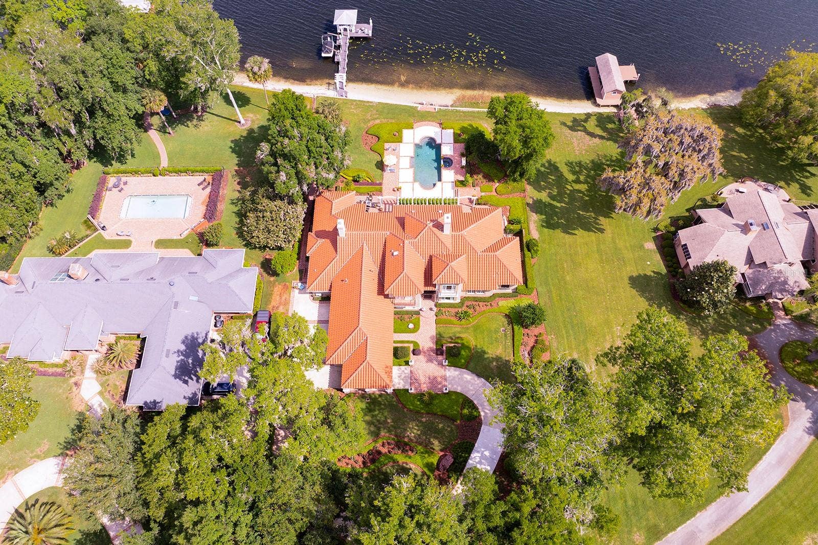 1351 N CLASSIC COURT, Longwood, FL 32779 CUSTOM BUILT SHOWPLACE is nestled back on a LUSH, PRIVATE ENCLAVE oversized flag lot of *4.08-Acres *Over 1 + acres for residence.