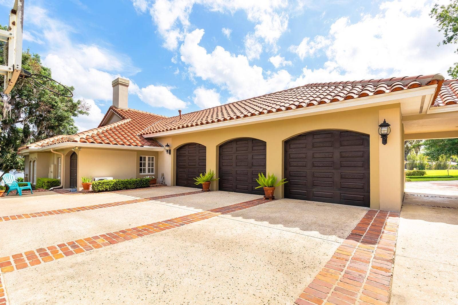 1351 N CLASSIC COURT, Longwood, FL 32779 Side rear 3 car garage with plenty of storage space and parking.