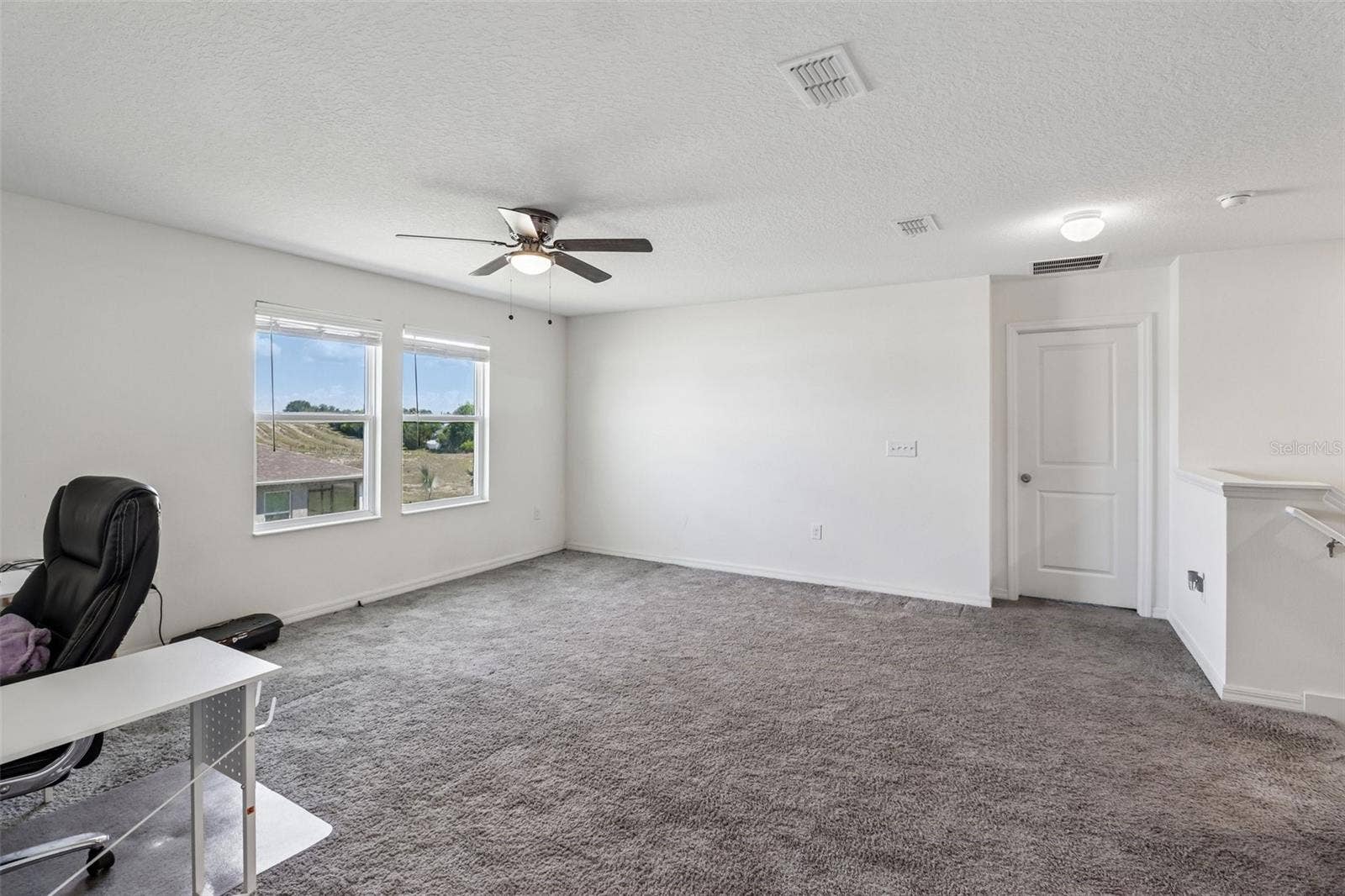 Large bonus/loft at the top of stairs.