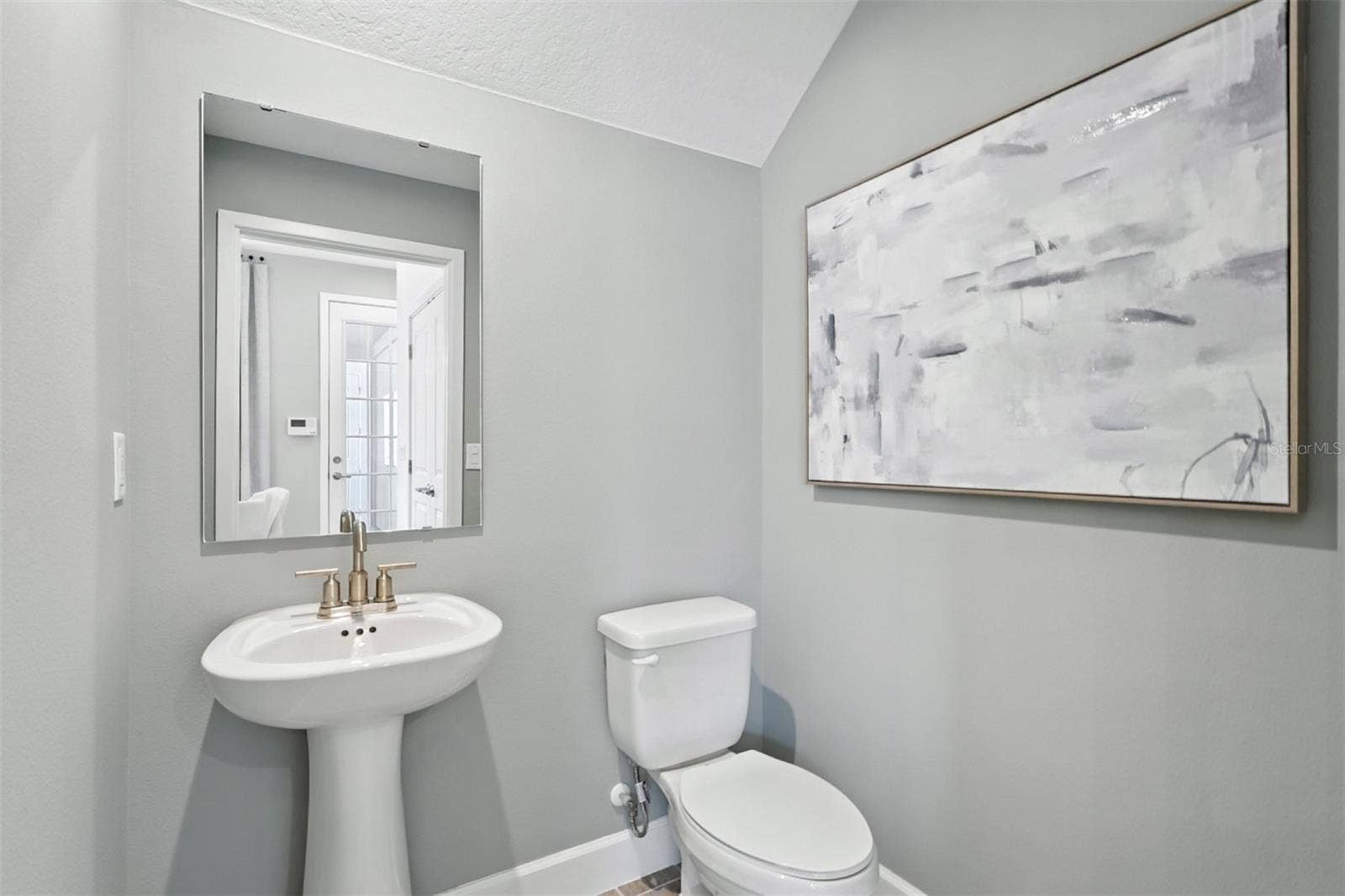 1792 HEADLAND LOOP, Celebration, FL 34747 Island Village Amelia Model Half Bath / Powder Room