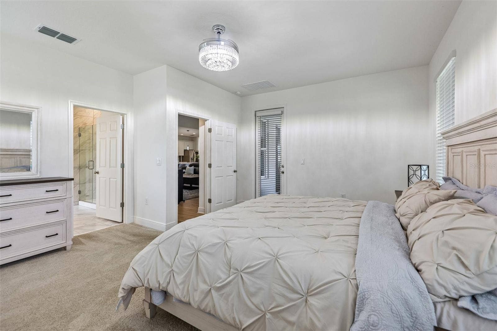 The primary suite includes direct access to the lanai.