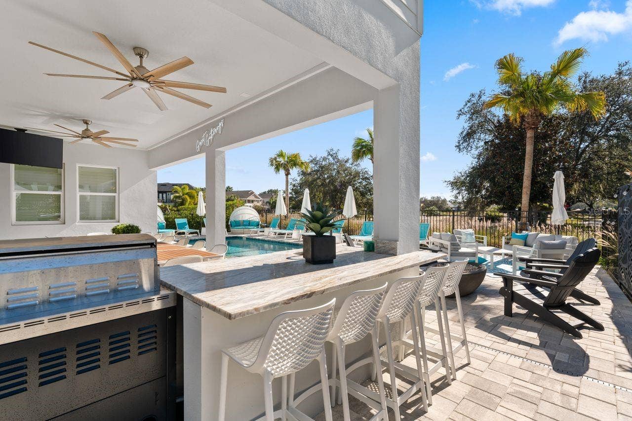 7442 GATHERING COURT, Kissimmee, FL 34747 Outdoor Counter with Bar Stools