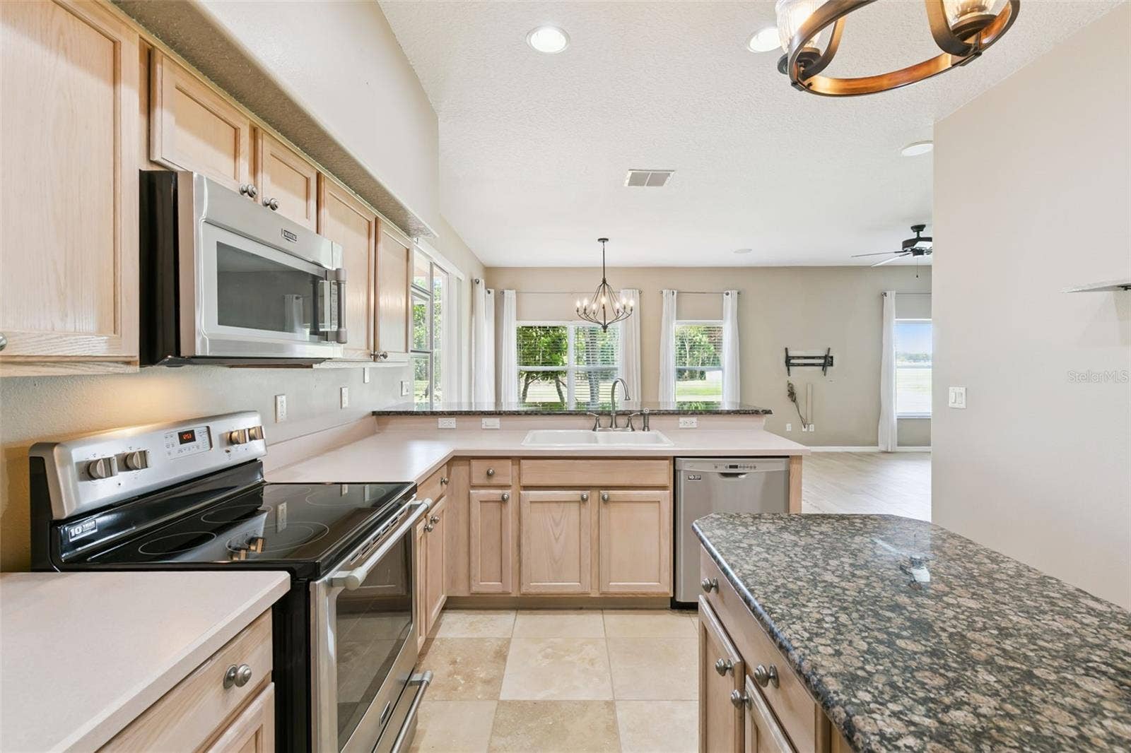 237 STRATHMORE CIRCLE, Kissimmee, FL 34744 Kitchen island with storage.