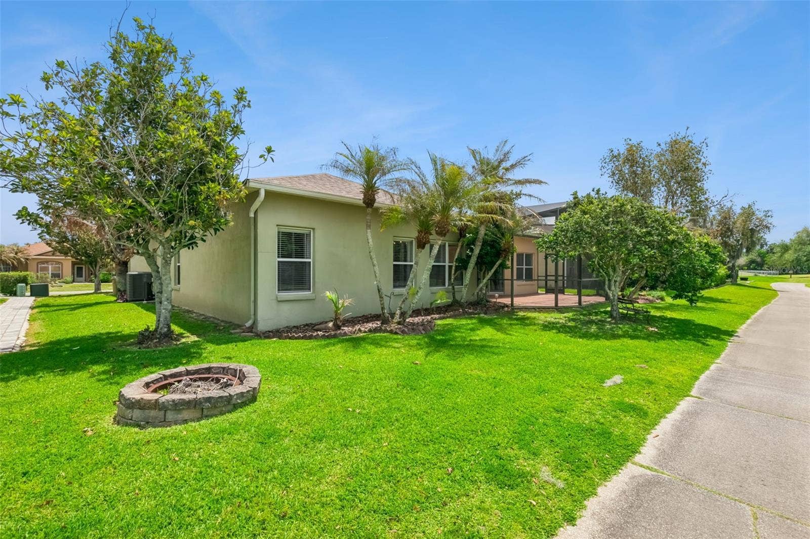 237 STRATHMORE CIRCLE, Kissimmee, FL 34744 Rear view of the home from cart path.