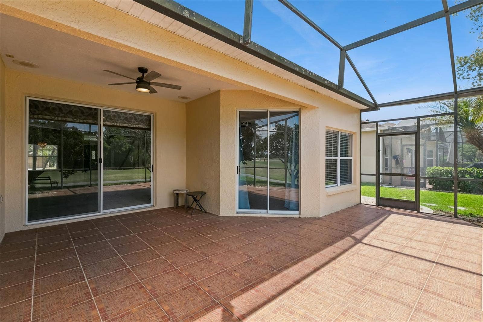 237 STRATHMORE CIRCLE, Kissimmee, FL 34744 Large screened patio, accessible from 3 interior areas.