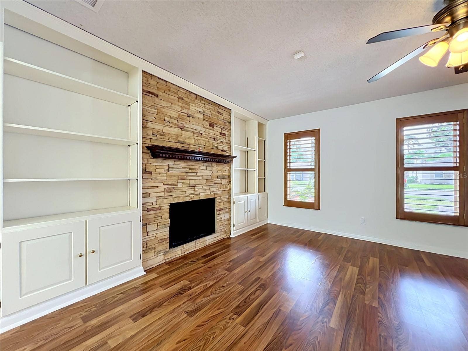 105 CEDAR OAK TRAIL, Longwood, FL 32750 Cozy fireplace surrounded by stone