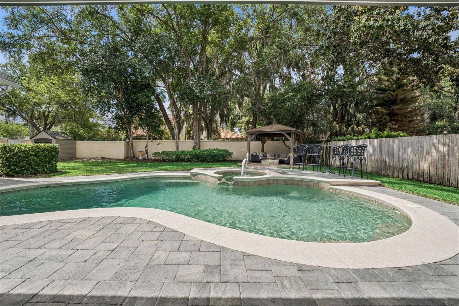 450 LAKEWOOD DRIVE, Winter Park, FL 32789 Pool and backyard with gazebo area and fire pit