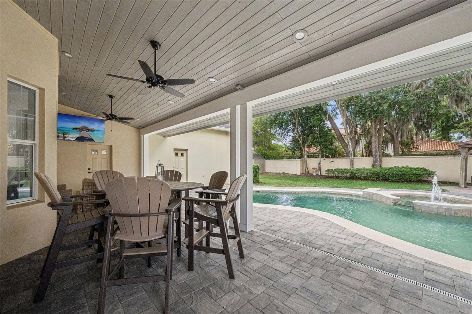 450 LAKEWOOD DRIVE, Winter Park, FL 32789 Pool area with new paver deck and covered lanai