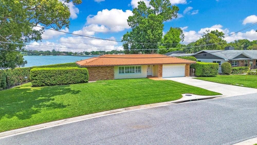 3108 TROY DRIVE, Orlando, FL 32806 Exterior with Lake