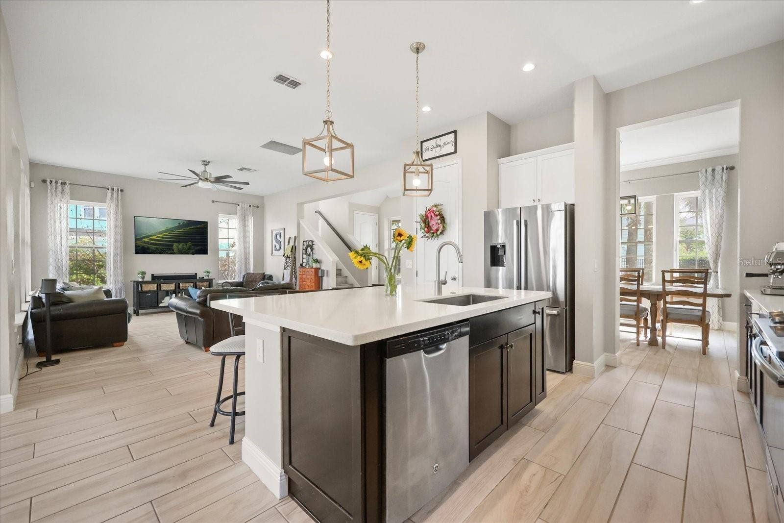 13358 BEEBE ALLEY, Orlando, FL 32827 Kitchen with island open to family room