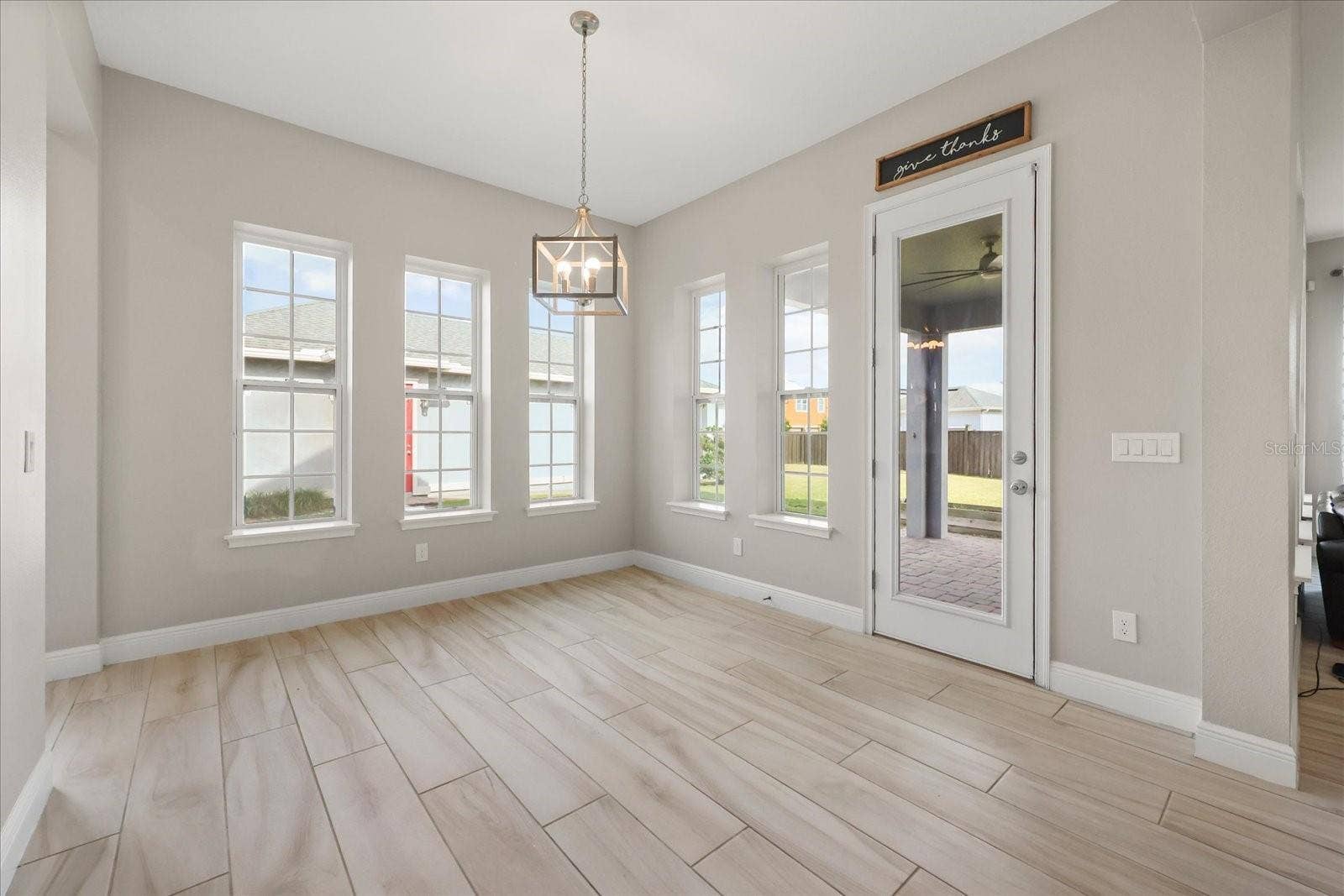 13358 BEEBE ALLEY, Orlando, FL 32827 Breakfast nook w/ door to lanai