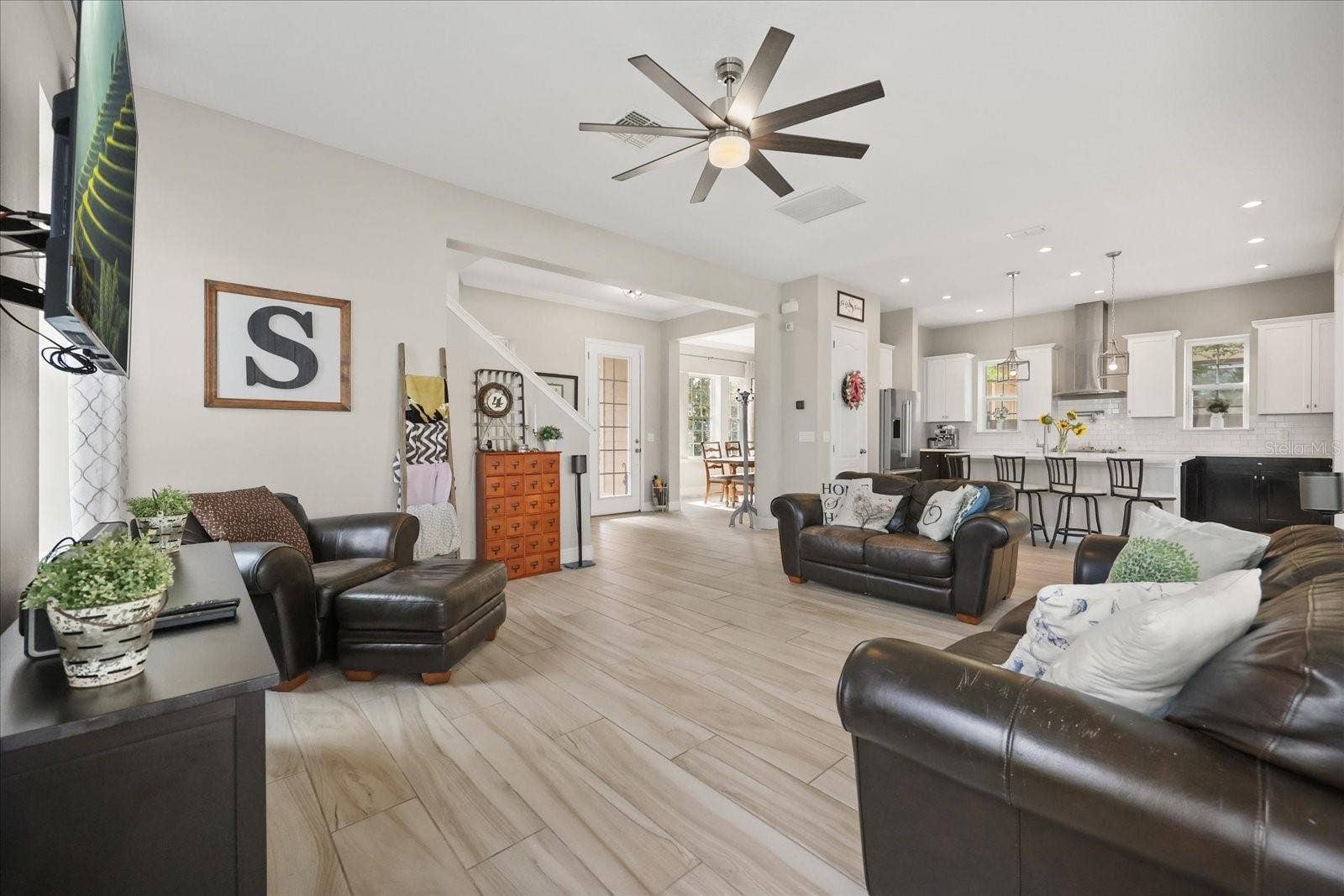 13358 BEEBE ALLEY, Orlando, FL 32827 Family room looking to front door/dining room/kitchen