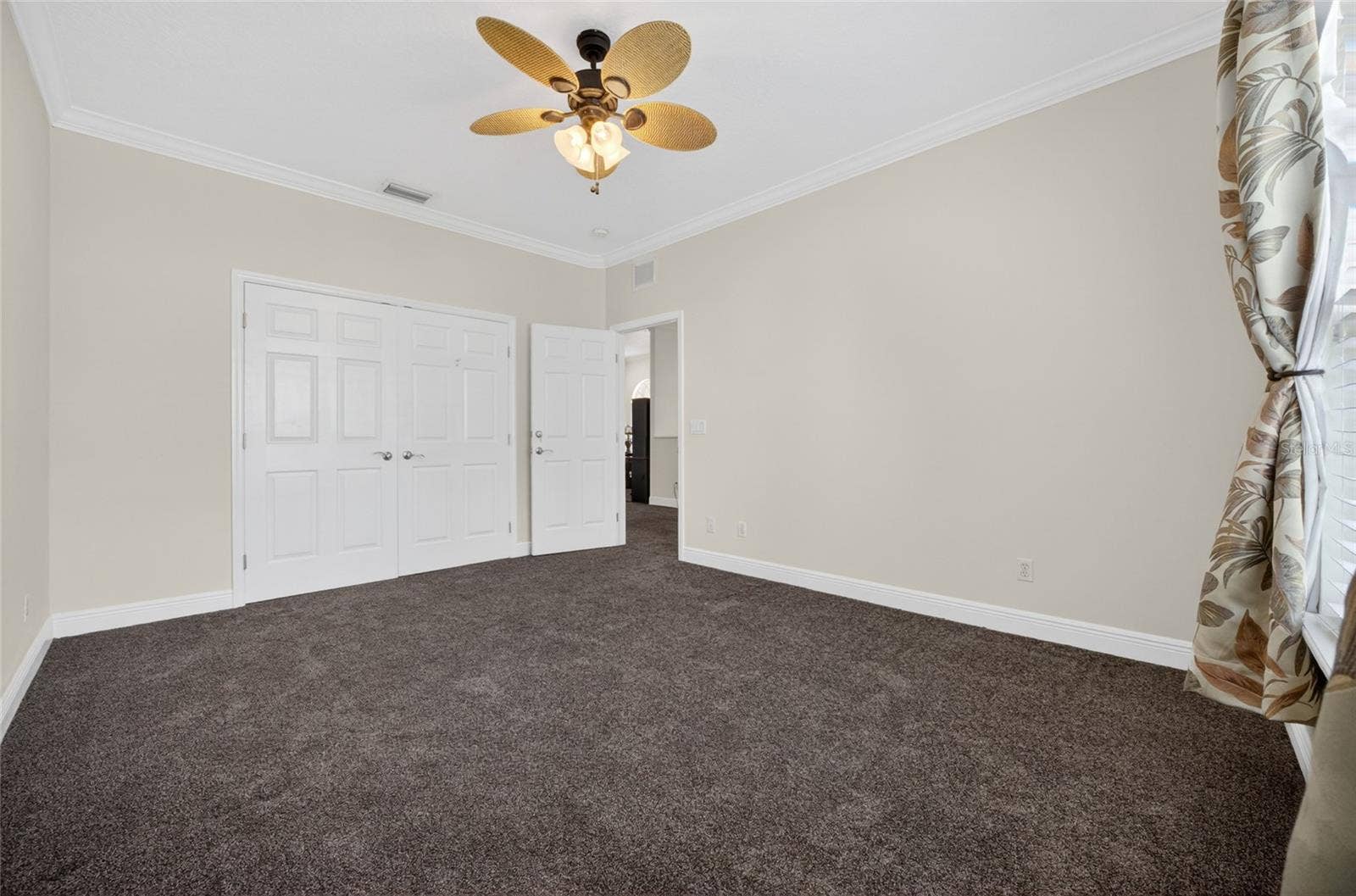 279 ZACHARY WADE STREET, Winter Garden, FL 34787 Bedroom across from the stairs with ceiling fan and double closet