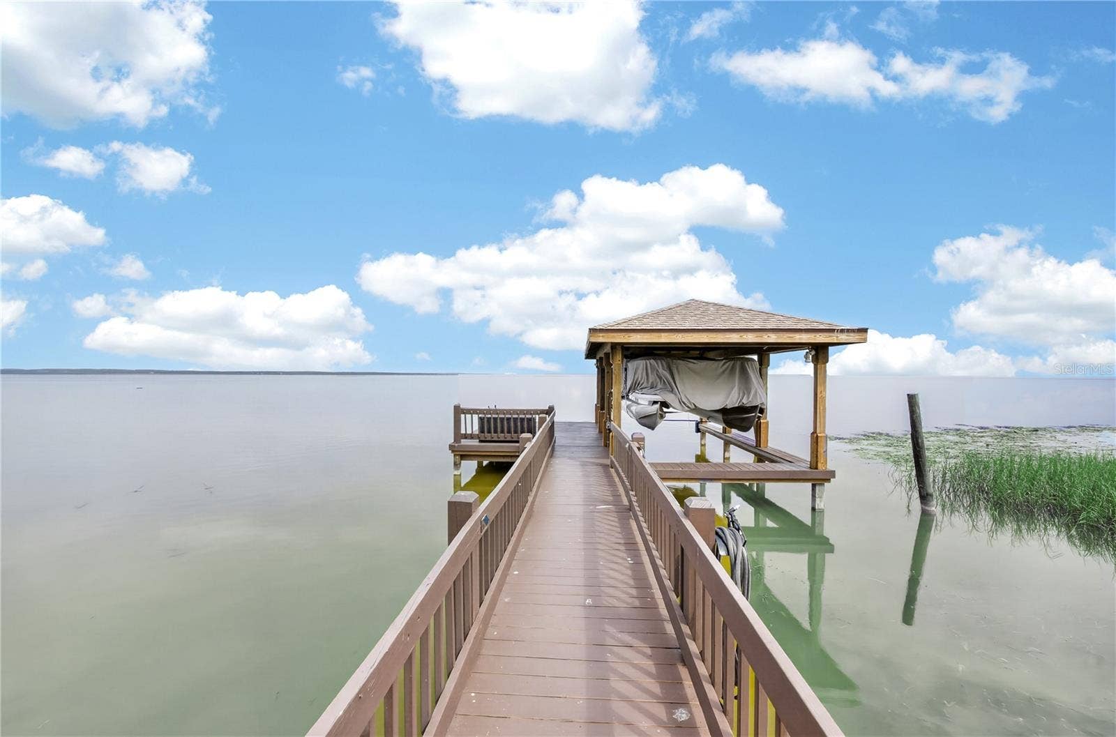 279 ZACHARY WADE STREET, Winter Garden, FL 34787 Boat dock with covered boat lift. New roof on the boat lift 2025