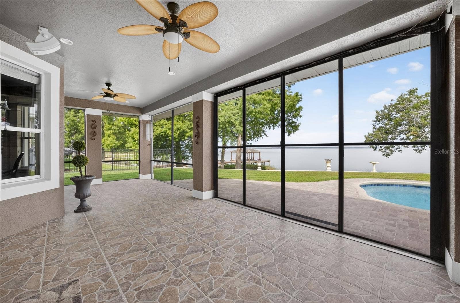 279 ZACHARY WADE STREET, Winter Garden, FL 34787 Covered screened patio with gorgeous lake views!