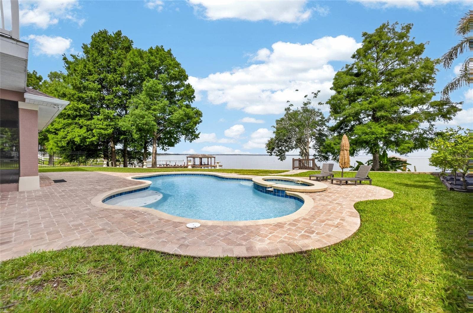 279 ZACHARY WADE STREET, Winter Garden, FL 34787 Artistically designed patio area with heated pool and raised spa