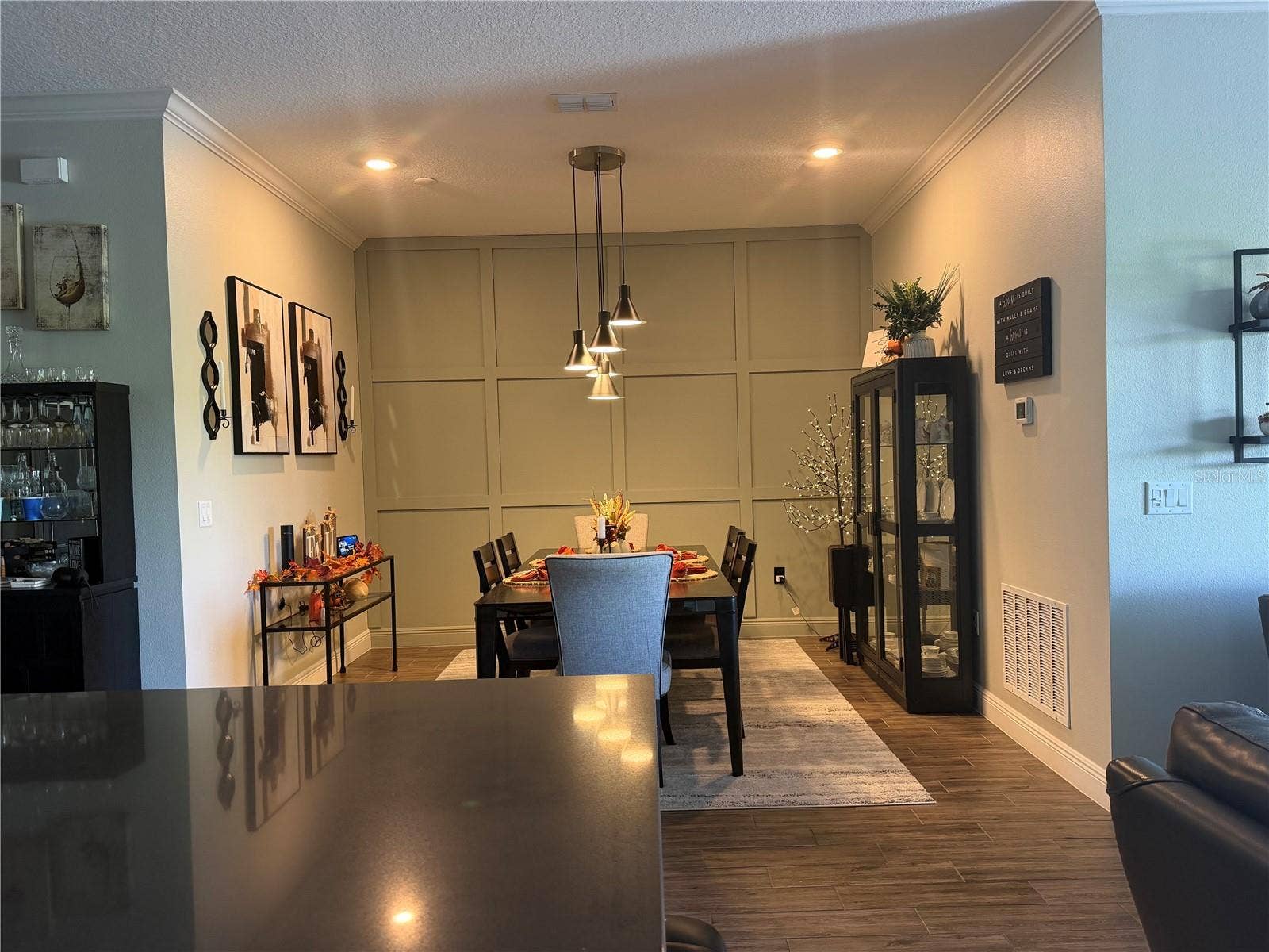 16136 VOLTERRA POINT, Bella Collina, FL 34756 Dining room with accent wall