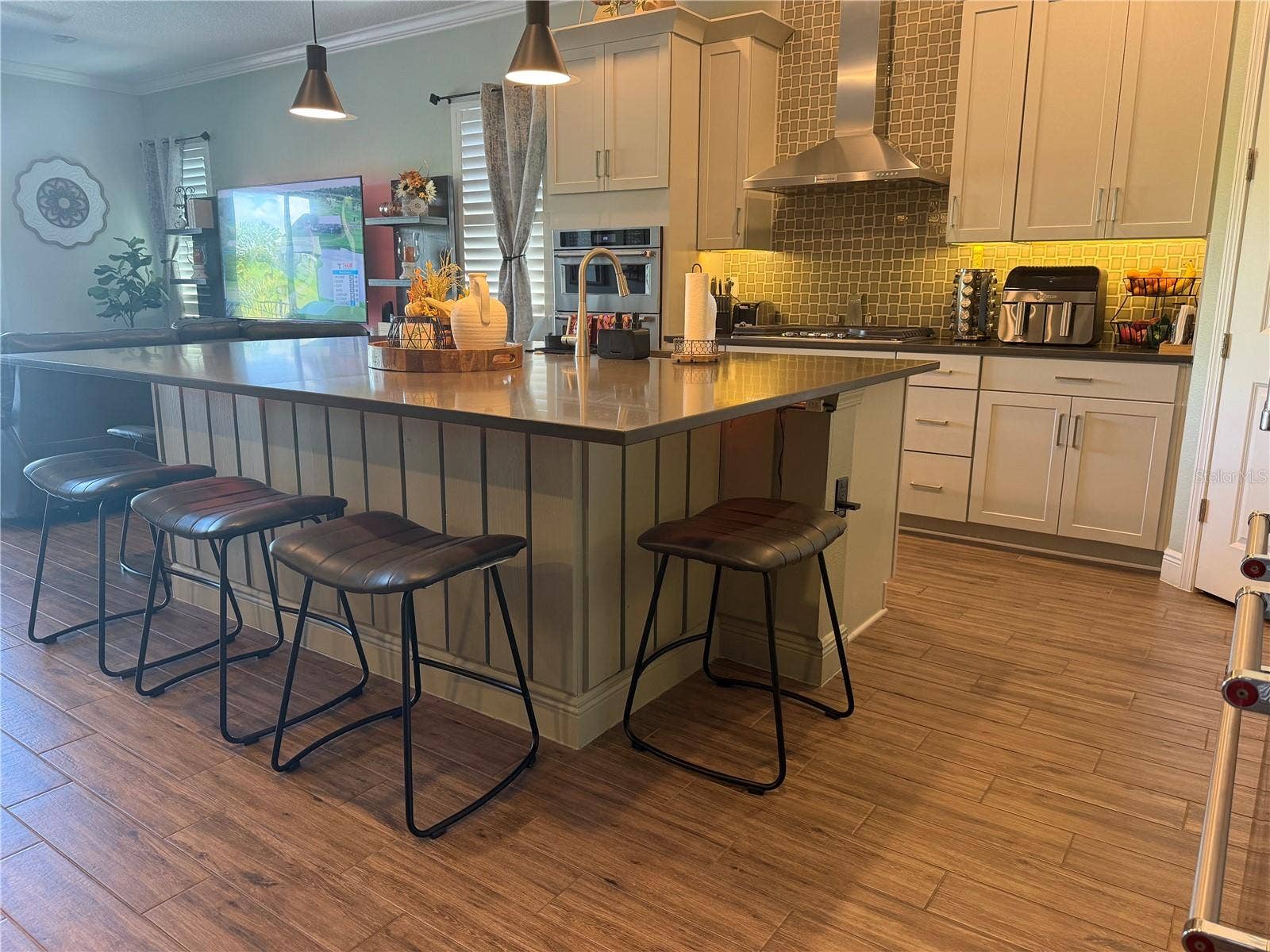 16136 VOLTERRA POINT, Bella Collina, FL 34756 Spacious island with barstools.