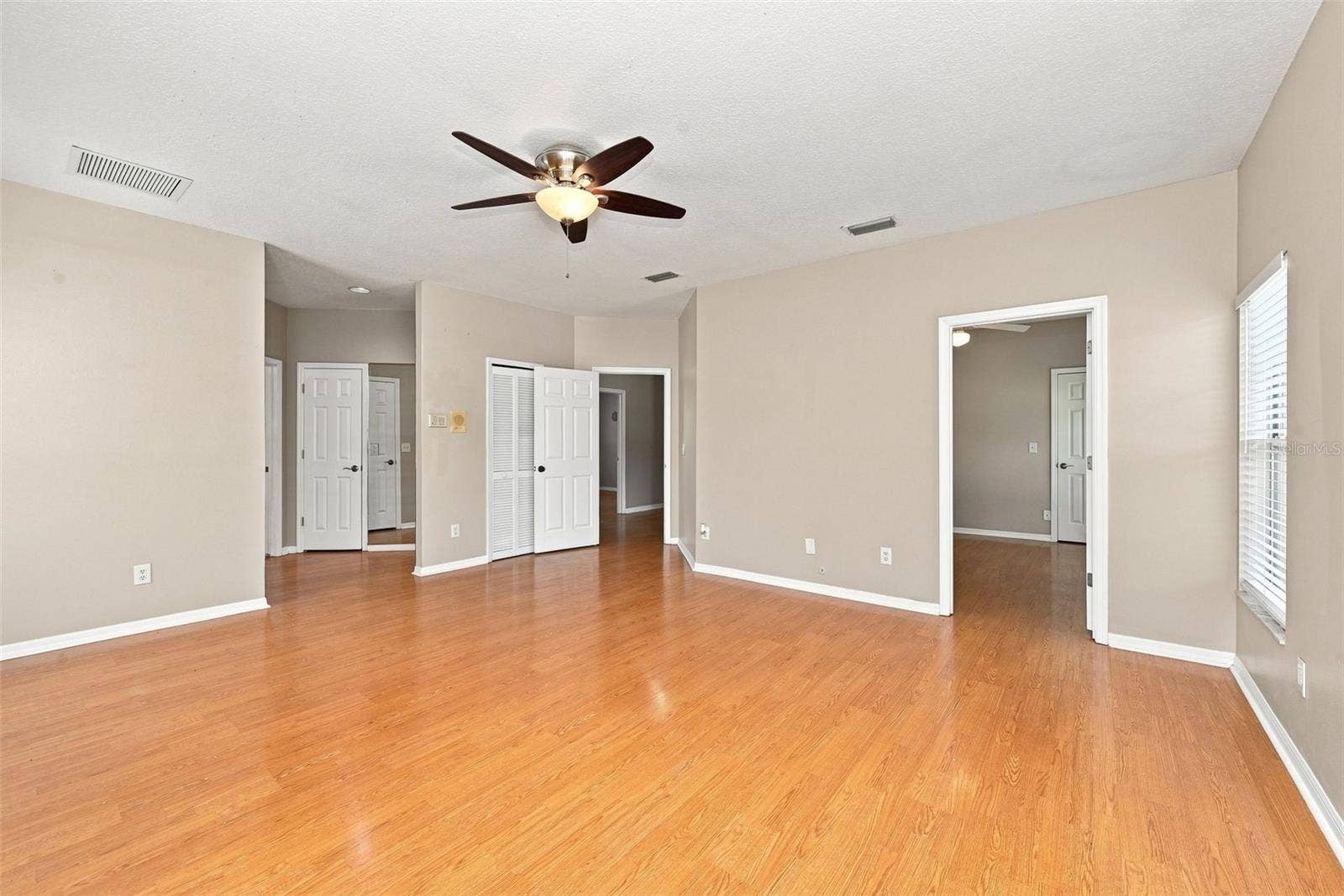 1349 VALLEY PINE CIRCLE, Apopka, FL 32712 Versatile Primary Suite Layout includes generous bedroom space and an adjoining room that can function as a nursery, office, gym, sitting room, or private retreat.