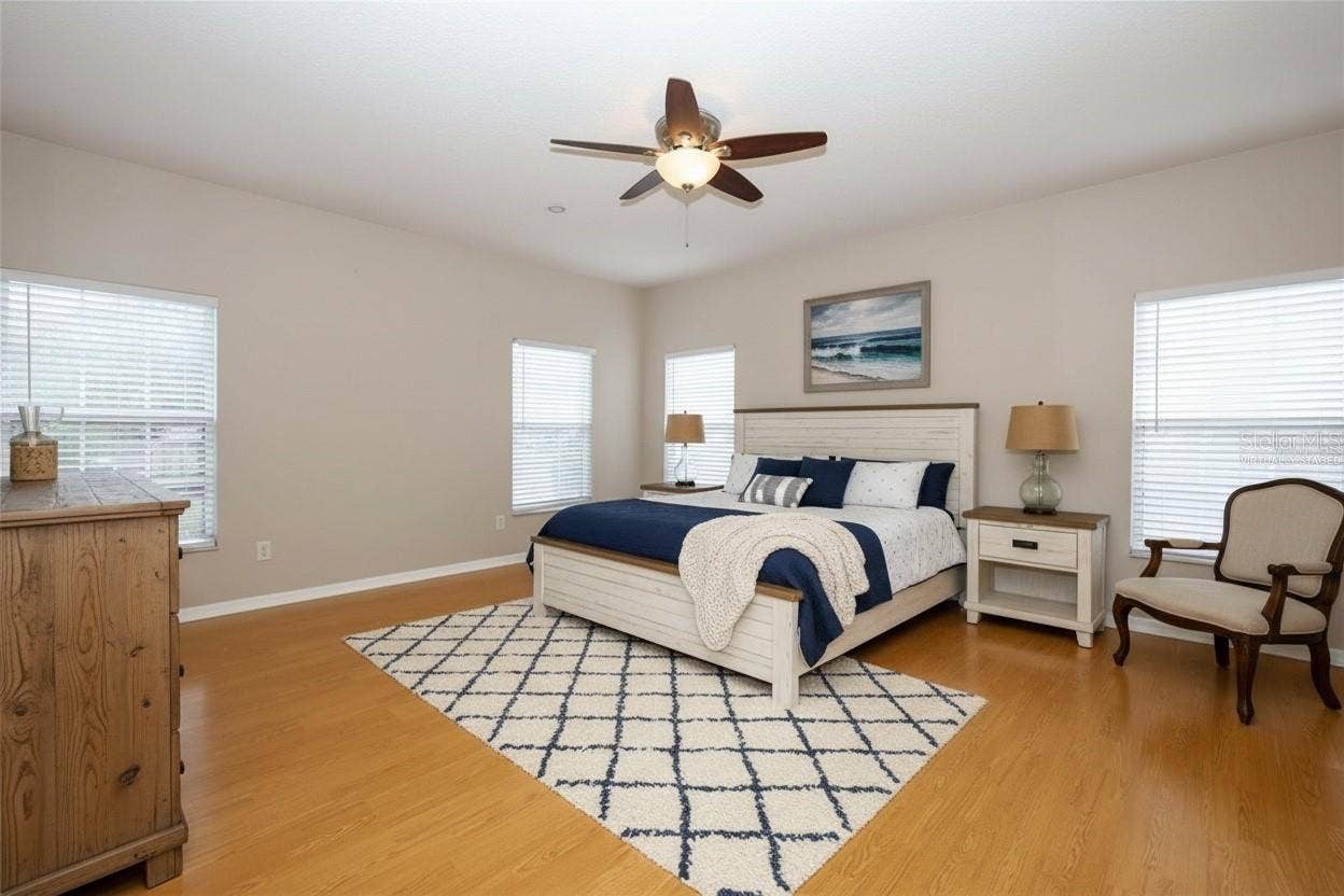 1349 VALLEY PINE CIRCLE, Apopka, FL 32712 Spacious Apopka Primary Bedroom provides room for a king-size bedroom set, sitting area, and additional furnishings while maintaining a comfortable retreat-like feel.