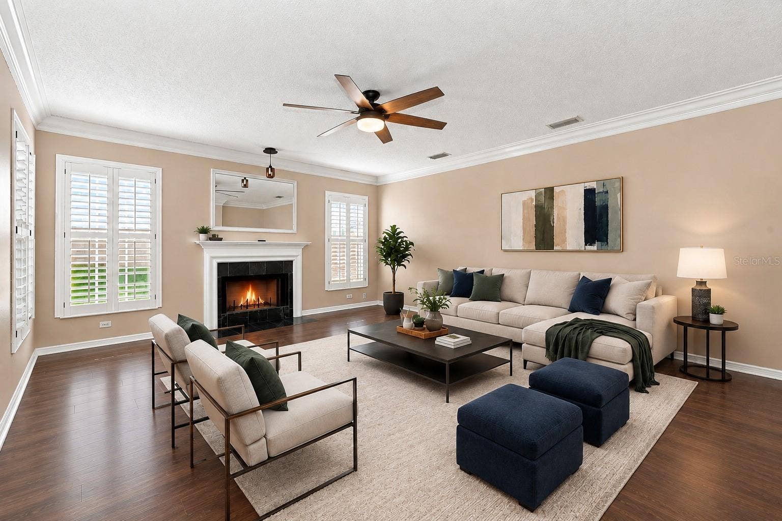 1349 VALLEY PINE CIRCLE, Apopka, FL 32712 Spacious Formal Living Room featuring BRAND NEW LVP flooring, crown molding, plantation shutters, and a cozy wood-burning fireplace.