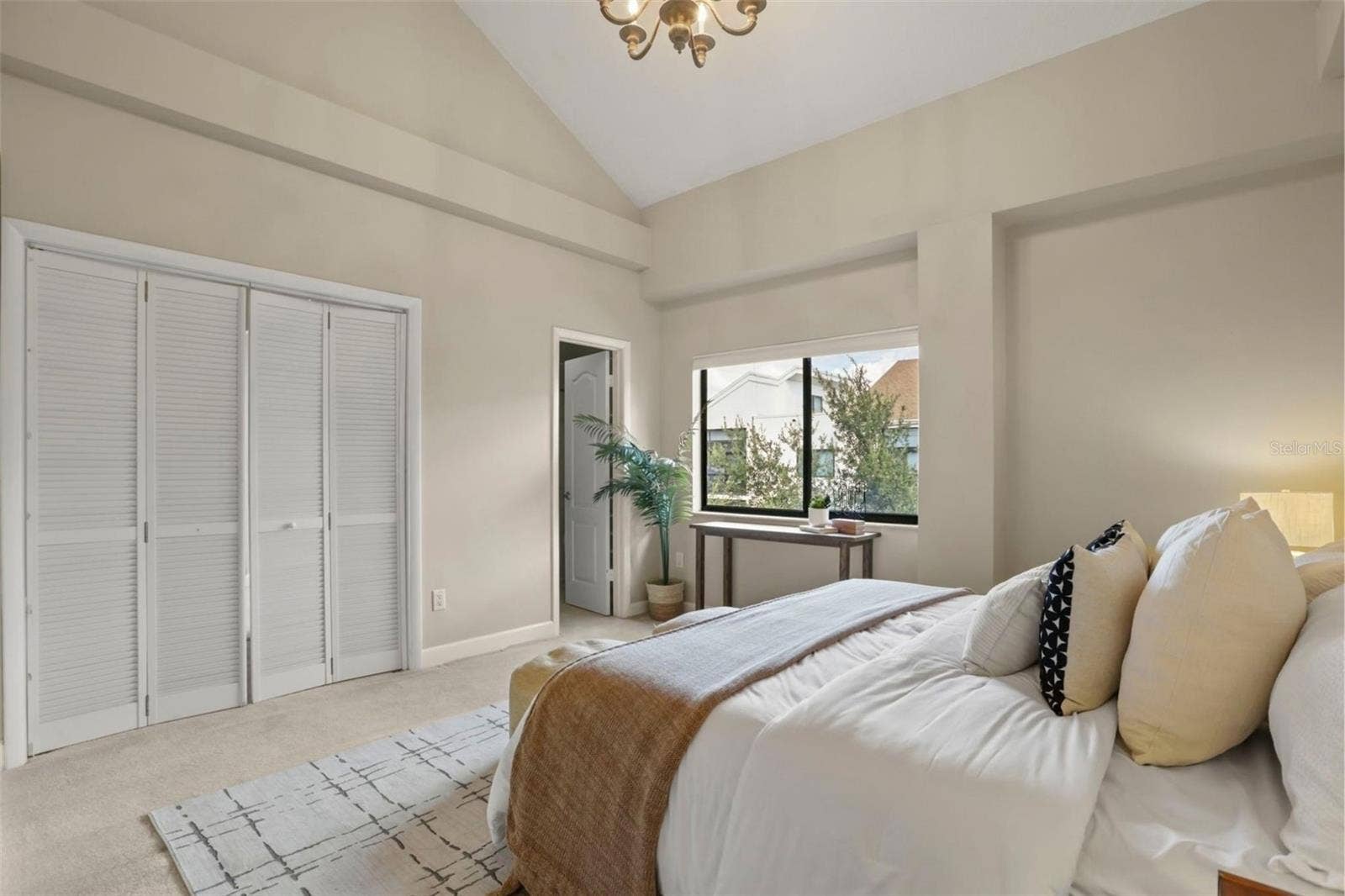 300 CAROLINA AVENUE, #402C, Winter Park, FL 32789 The primary suite with a large window overlooking the Park West garden and ornamental pond.