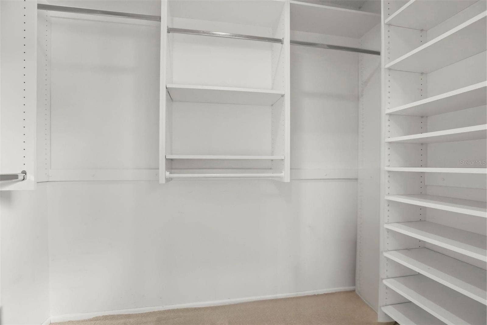 300 CAROLINA AVENUE, #402C, Winter Park, FL 32789 The primary suite features a vast walk-in closet enhanced with custom wall unit storage units.