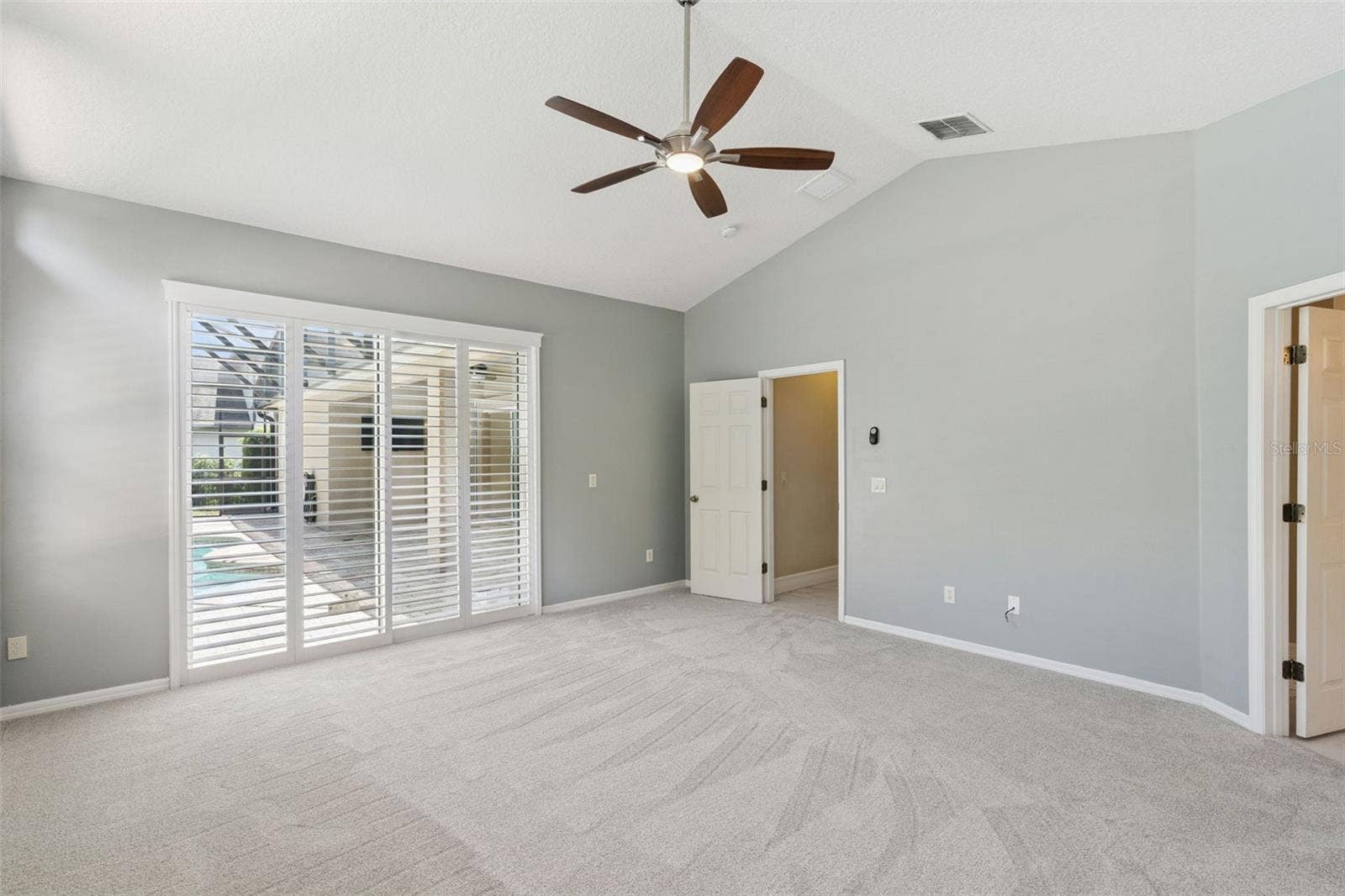 PRIMARY BEDROOM WITH POOL VIEW