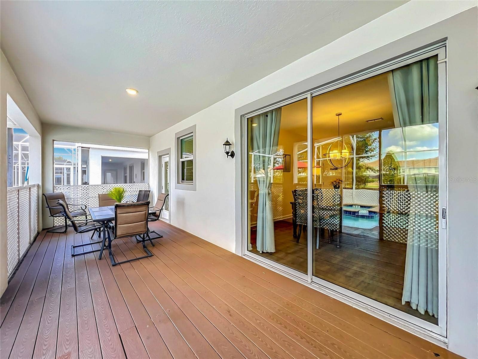 1556 MAIDSTONE COURT, Davenport, FL 33896 Covered lanai with upgraded wood flooring.