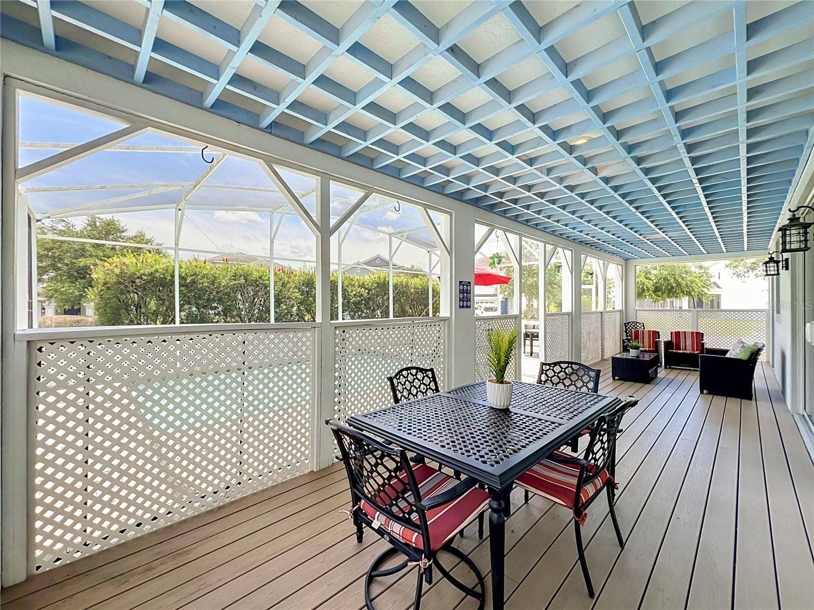 1573 MAIDSTONE COURT, Davenport, FL 33896 Covered lanai with upgraded wood flooring / wood ceiling accents.