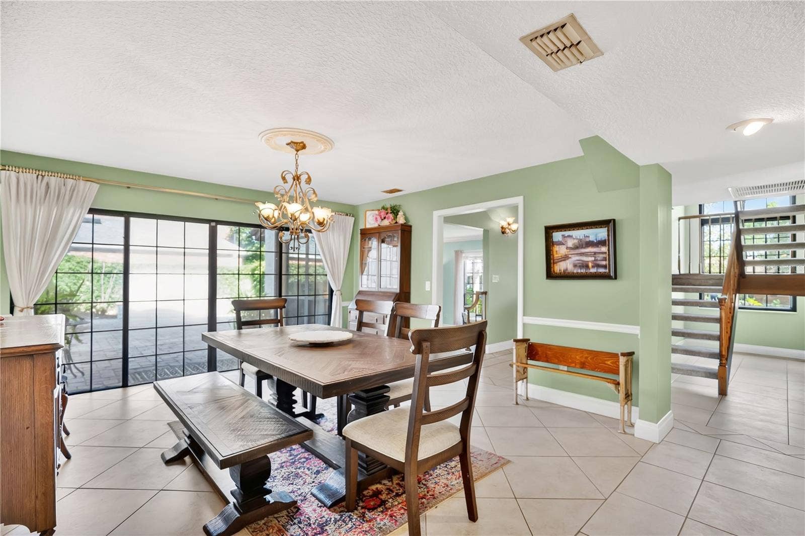 1367 CAMPBELL STREET, Orlando, FL 32806 The formal dining room leads to an outdoor courtyard and fountain.