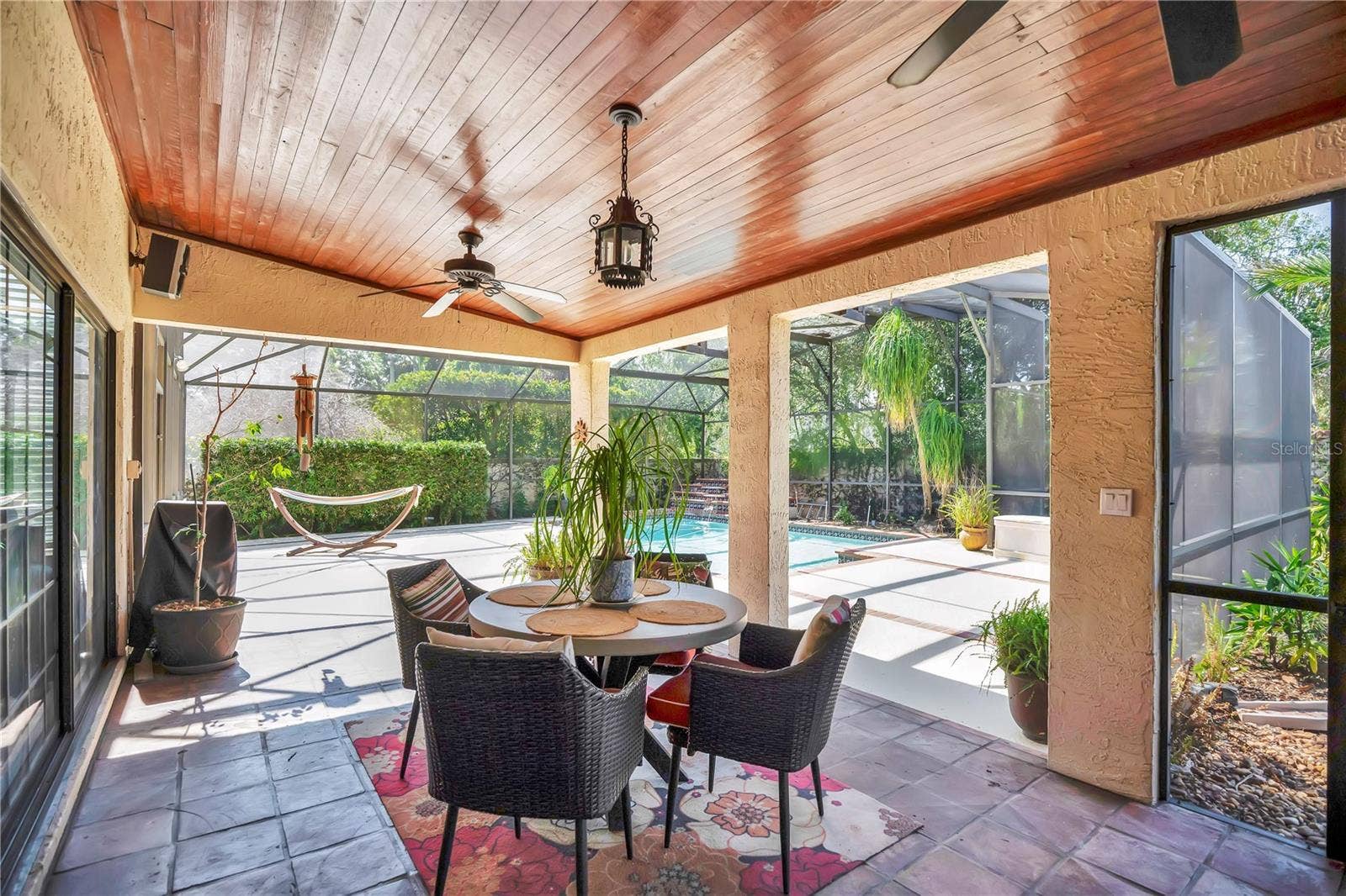 1367 CAMPBELL STREET, Orlando, FL 32806 The patio off of the great room is covered for comfort