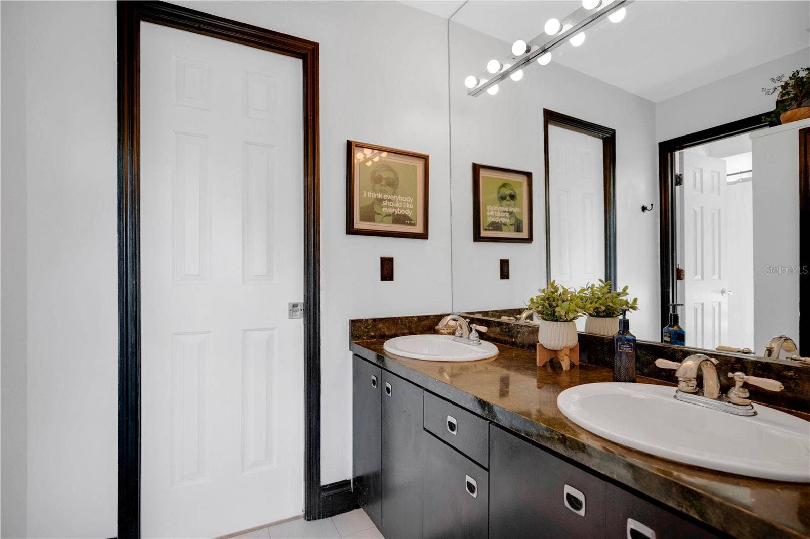 1367 CAMPBELL STREET, Orlando, FL 32806 A Jack-and-Jill bathroom sits between bedrooms three and four.