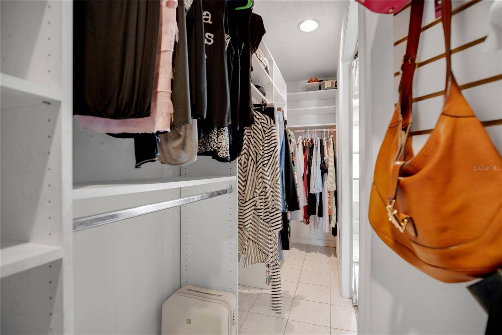 1367 CAMPBELL STREET, Orlando, FL 32806 Both closets in the primary were thoughtfully finished in California Closet Design