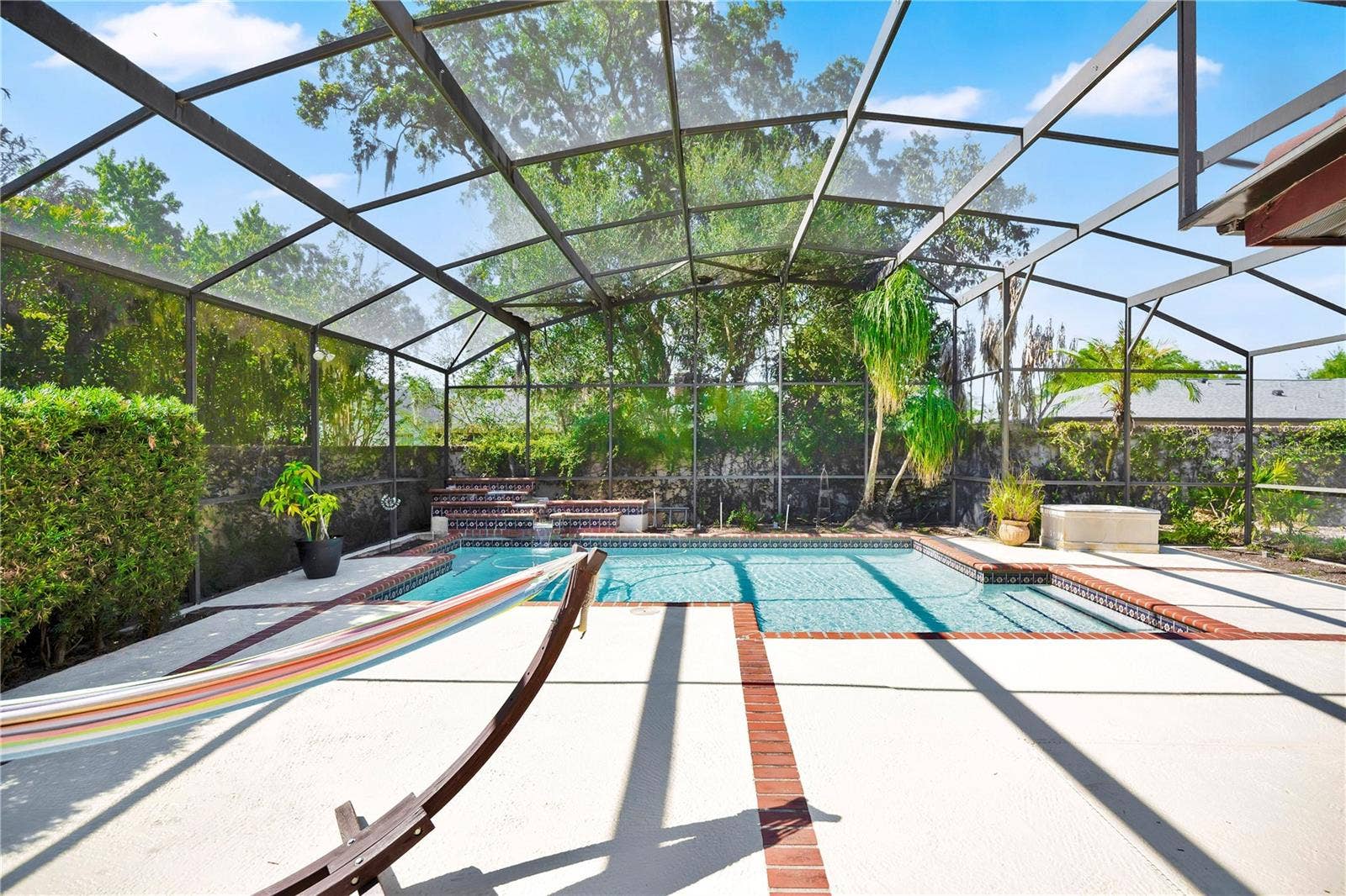 1367 CAMPBELL STREET, Orlando, FL 32806 The screen-enclosed pool invites you to enjoy the Florida summer