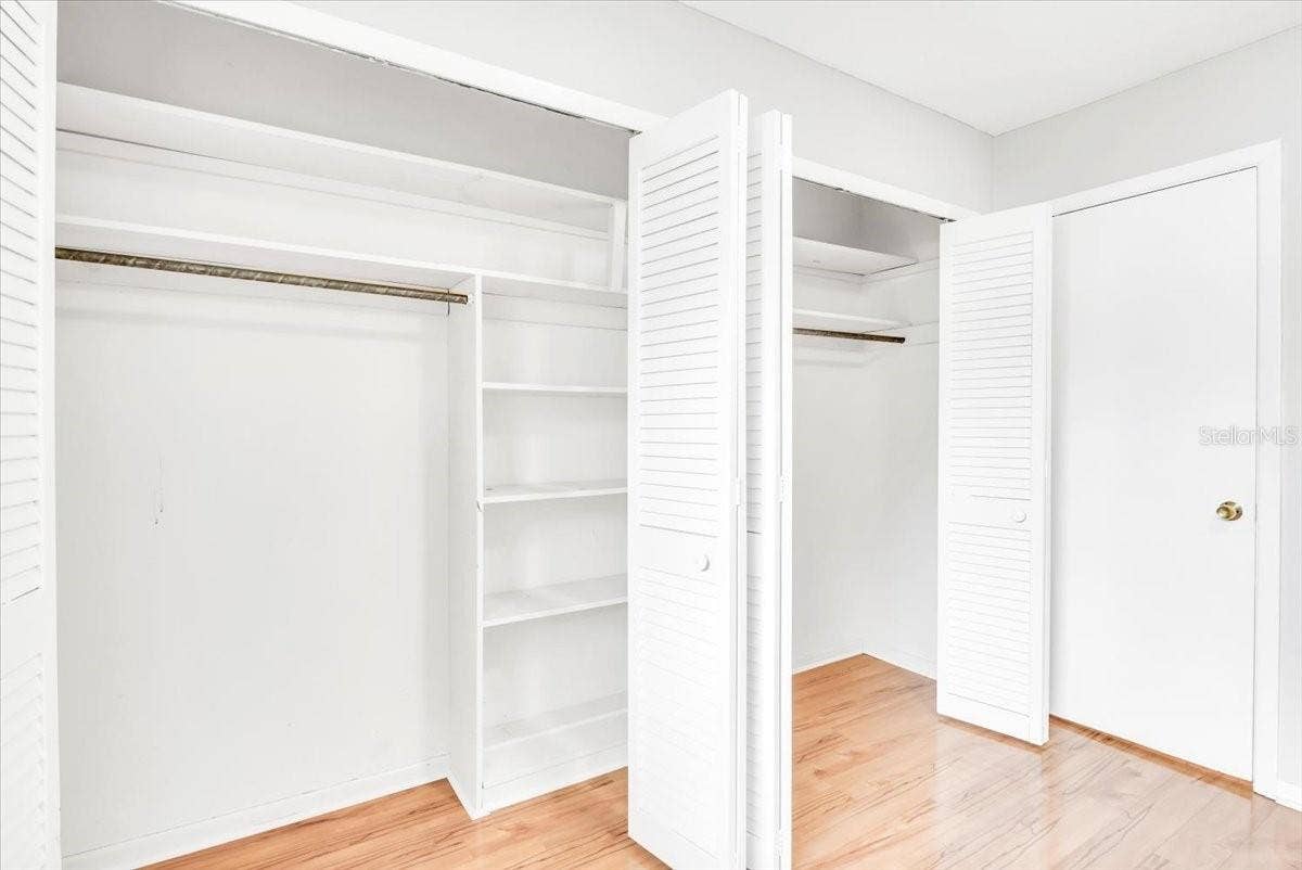715 S RANGER BOULEVARD, Winter Park, FL 32792 Bedroom #3 features large closet with hardwood flooring.