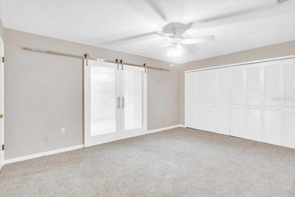 715 S RANGER BOULEVARD, Winter Park, FL 32792 New barn style doors in primary bedroom suite.