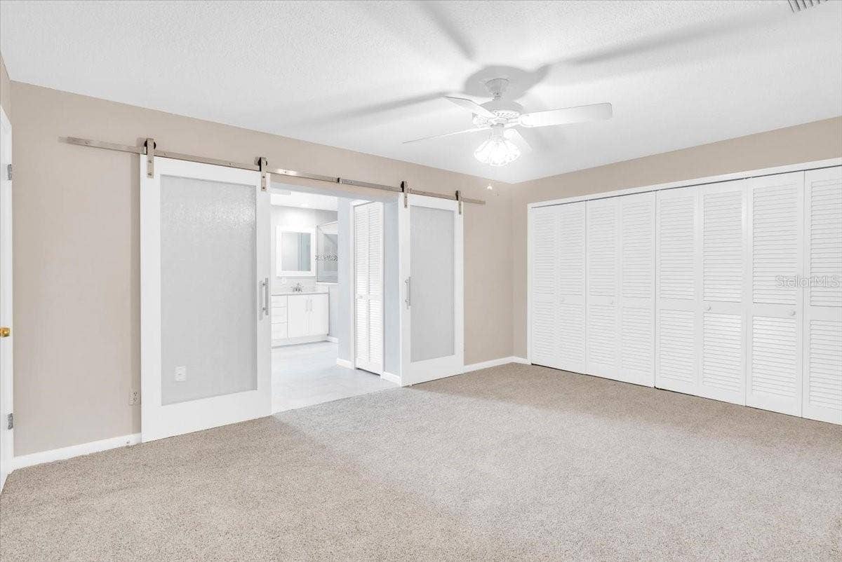 715 S RANGER BOULEVARD, Winter Park, FL 32792 Primary bedroom suite with new carpeting and paint.