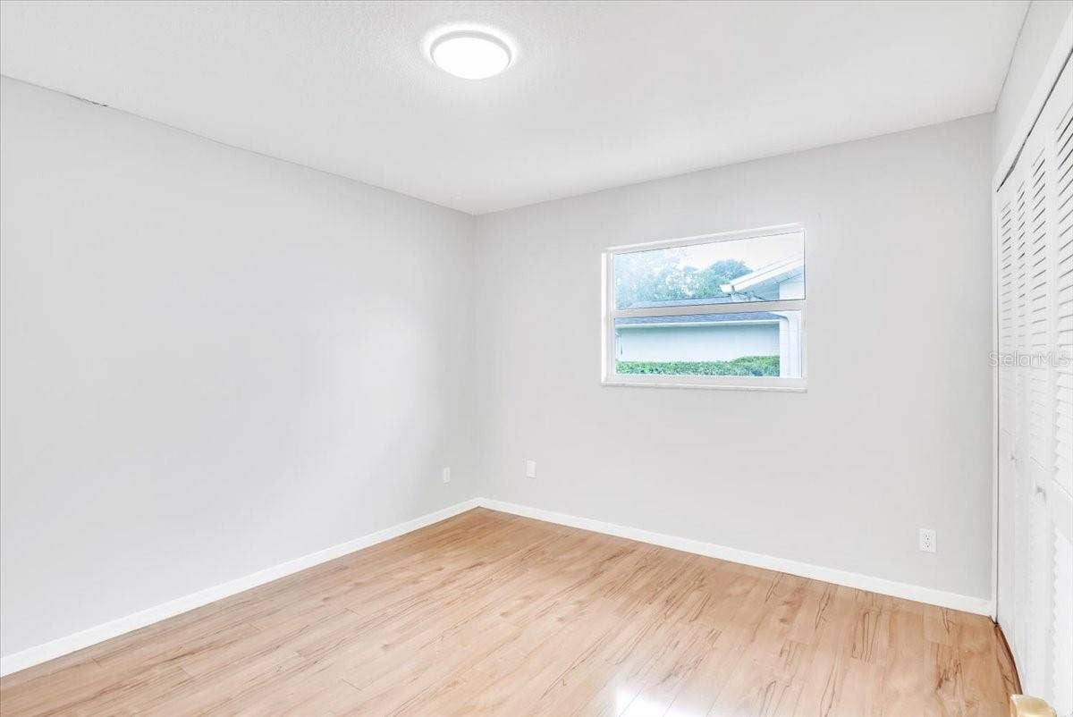 715 S RANGER BOULEVARD, Winter Park, FL 32792 Bedroom #2 with hardwood flooring.